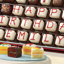 Personalized petits fours with Happy Birthday Emily written on them - purchase on credit