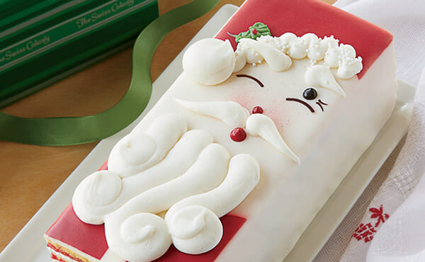 Vanilla Torte with Strawberry filling decorated as a winking Santa