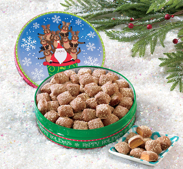 Mini butter toffee pieces in an open santa and reindeer tin - available on credit